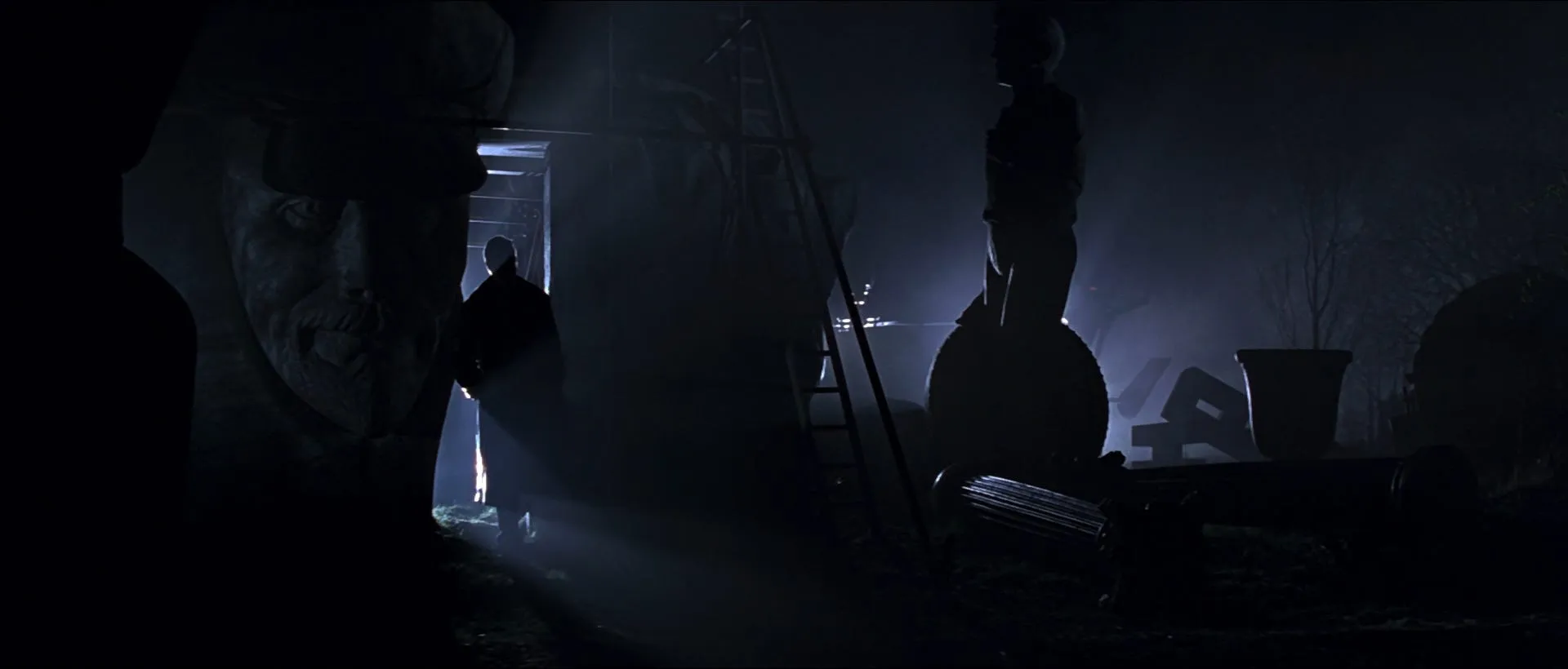 Shadowy figures amid the eerie Soviet statue graveyard in GoldenEye