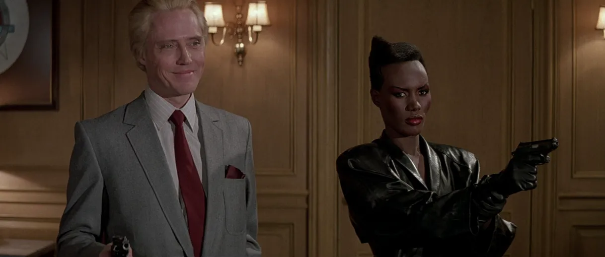 Christopher Walken and Grace Jones brandish guns in A View to a Kill, both looking far too good for this movie