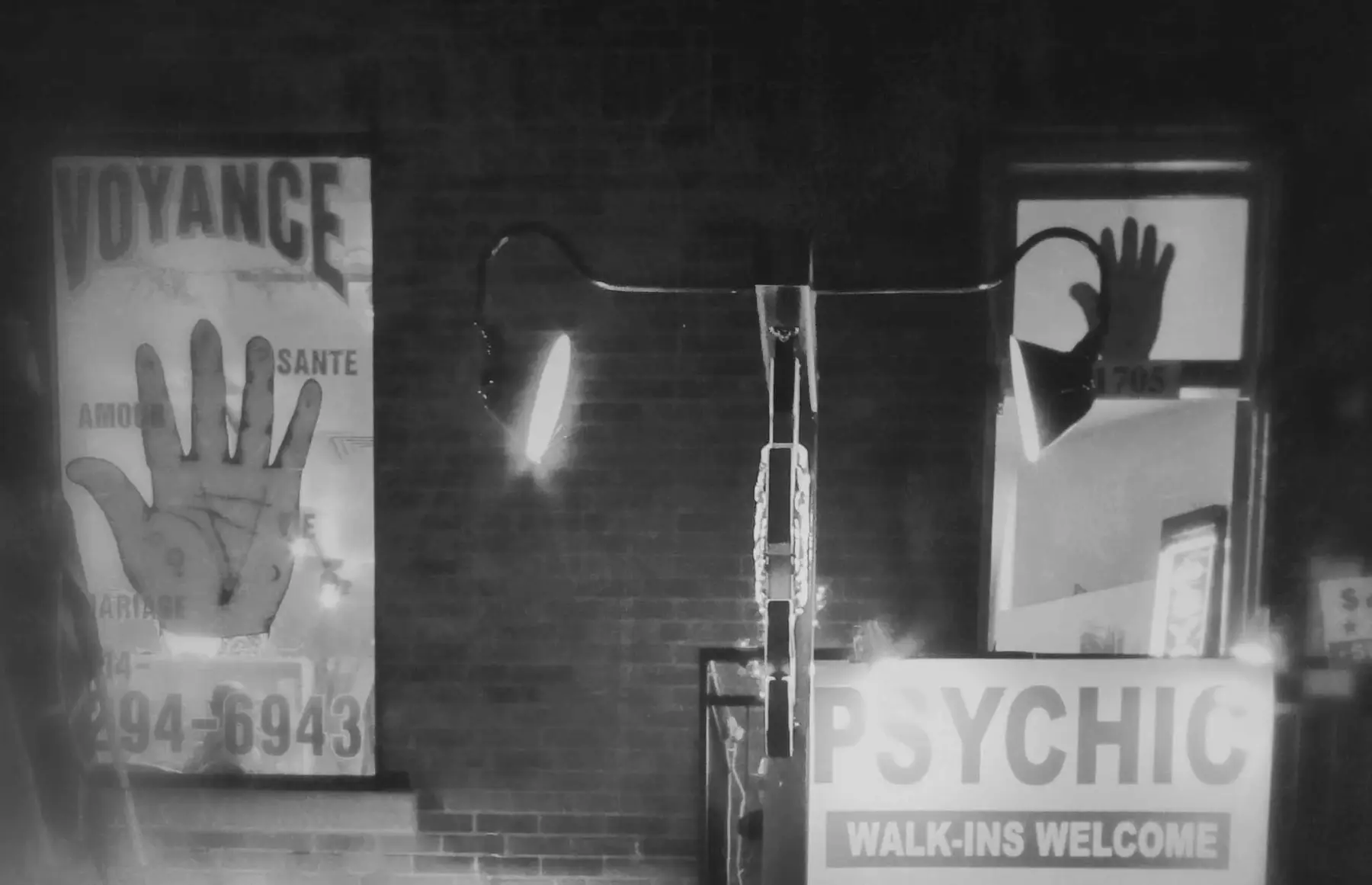 A dimly lit reading room with bookshelves